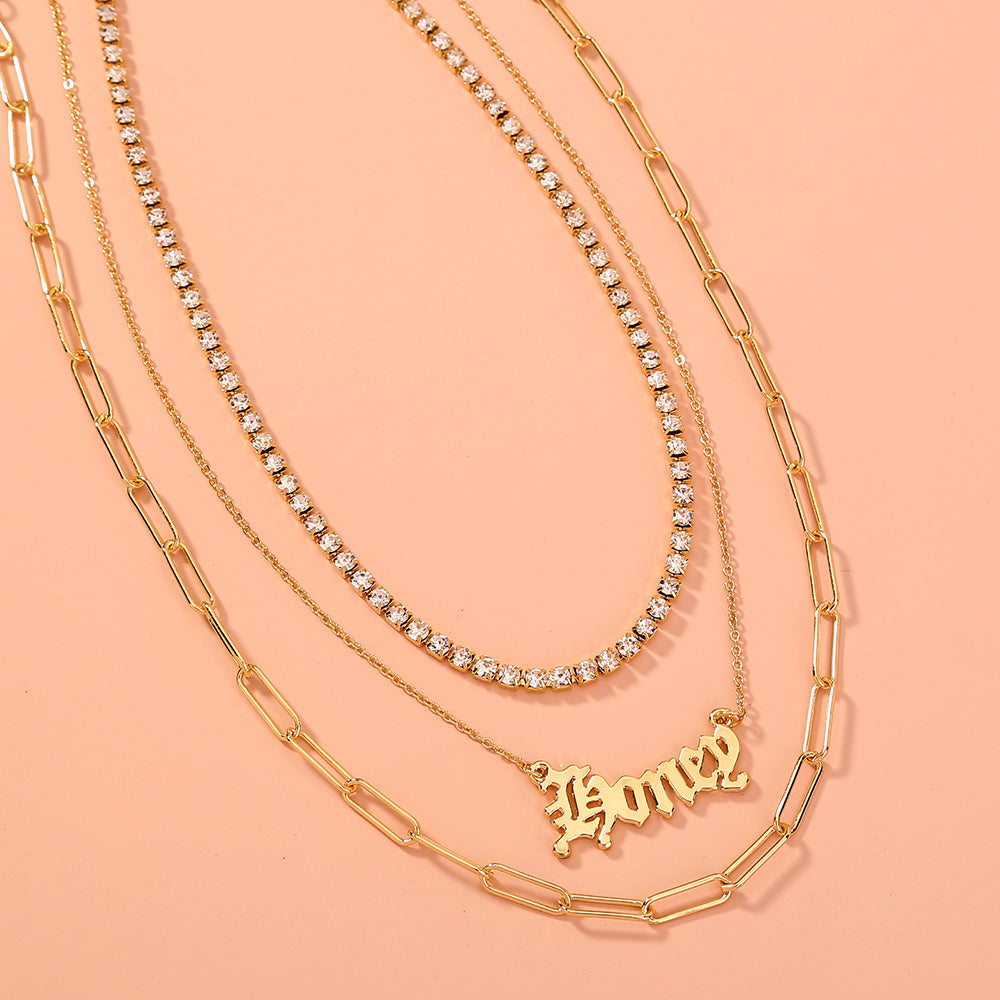 layered “Money” pendant necklace.